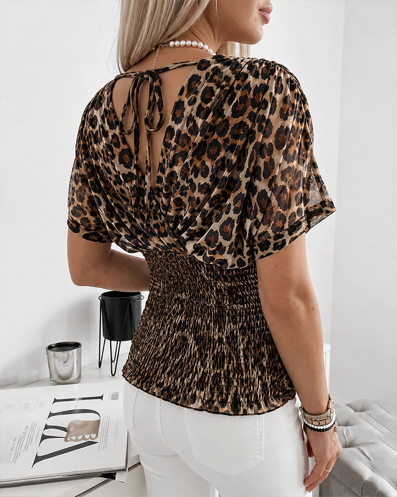 Alessia | Blusa cruzada con estampado de leopardo